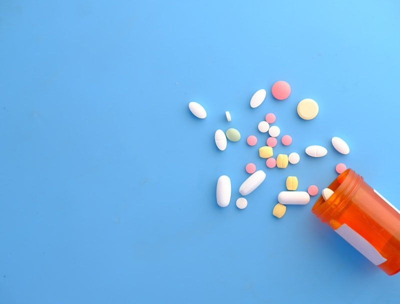 Orange and white prescription capsules